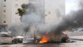 Cars are on fire after they were hit by rockets from the Gaza Strip in Ashkelon, Israel, on Saturday, Oct. 7, 2023. Palestinian militants in the Gaza Strip infiltrated Saturday into southern Israel and fired thousands of rockets into the country while Israel began striking targets in Gaza in response.