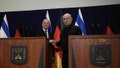 German Chancellor Olaf Scholz, left, shakes hands with Israeli Prime Minister Benjamin Netanyahu, during a press conference in Tel Aviv, Israel, Tuesday, Oct. 17, 2023.
