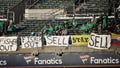 Fans of the Oakland Athletics with signs saying Managing Partner John Fisher should sell the team during the game against the Cincinnati Reds at RingCentral Coliseum on April 28, 2023 in Oakland, California.