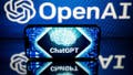 This picture taken on January 23, 2023 in Toulouse, southwestern France, shows screens displaying the logos of OpenAI and ChatGPT. - ChatGPT is a conversational artificial intelligence software application developed by OpenAI.