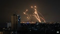 An Israeli missile launched from the Iron Dome defence missile system attempts to intercept a rocket, fired from the Gaza Strip, over the city of Netivot in southern Israel on October 8, 2023. Israel, reeling from the deadliest attack on its territory in half a century, formally declared war on Hamas Sunday as the conflict's death toll surged close to 1,000 after the Palestinian militant group launched a massive surprise assault from Gaza.