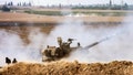 An Israeli army self-propelled howitzer fires rounds near the border with Gaza in southern Israel on October 11, 2023. Israel declared war on Hamas on October 8 following a shock land, air and sea assault by the Gaza-based Islamists. The death toll from the shock cross-border assault by Hamas militants rose to 1,200, making it the deadliest attack in the country's 75-year history, while Gaza officials reported more than 900 people killed as Israel pounded the territory with air strikes.