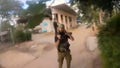 This image made from undated bodycam video footage taken by a downed Hamas terrorist and released by Israel Defense Forces shows a Hamas terrorist walking around a residential neighborhood at an undisclosed location in southern Israel. Israel's military brought together a group of foreign correspondents on Monday, Oct. 16, 2023, to screen a 40-minute reel of gruesome footage compiled from Hamas attack on Oct. 7.