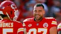 Travis Kelce #87 and Patrick Mahomes #15 of the Kansas City Chiefs talk before the game against the Los Angeles Chargers at GEHA Field at Arrowhead Stadium on October 22, 2023 in Kansas City, Missouri.