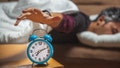 close up view of a sleepy guy trying to snooze a vintage clock - Fox News