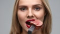Woman Eating Meat. Closeup of Healthy Hungry Girl With Beautiful Face, Red Lips Eats Delicious Grilled Meat. Female Mouth Biting Piece Of Tasty Beef Steak On Fork. Nutrition Concept. High Resolution - Fox News
