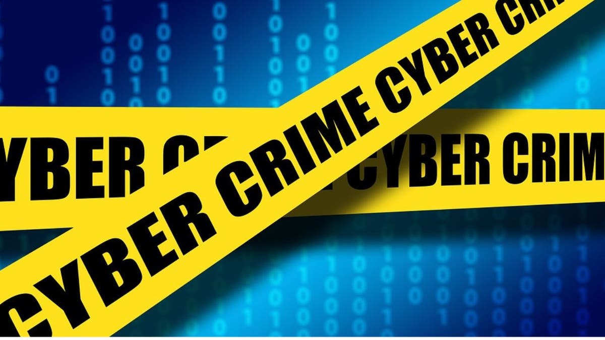 Graphic with caution tape that reads "Cyber Crime"