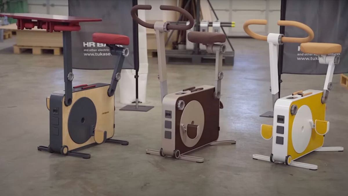 Three exercise bikes in a room