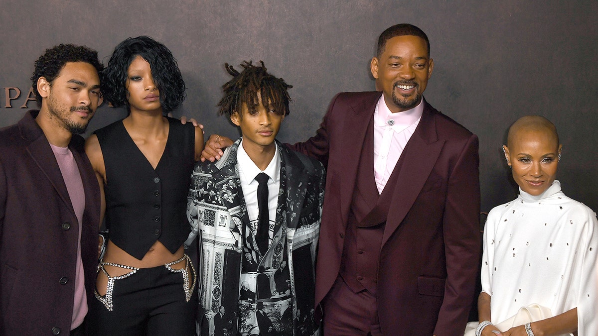 Jada Pinkett Smith and Will Smith with their family as they are in formal wear and all smiles