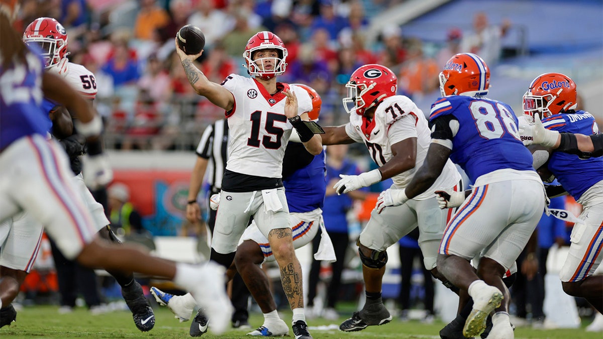 Carson Beck throws a pass against Florida