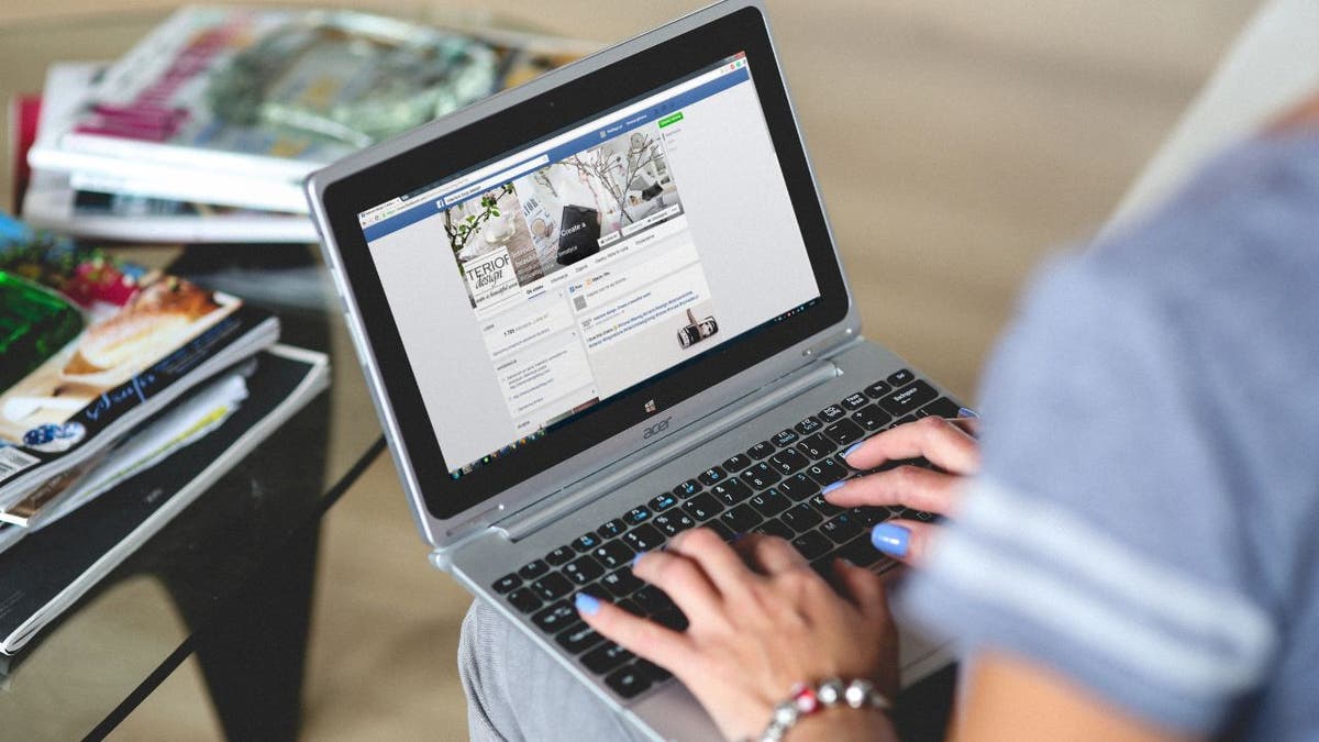 Woman typing on her laptop.