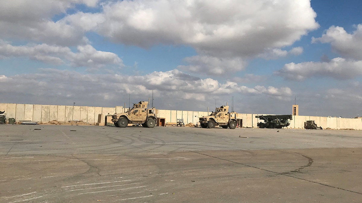 US vehicles on a base