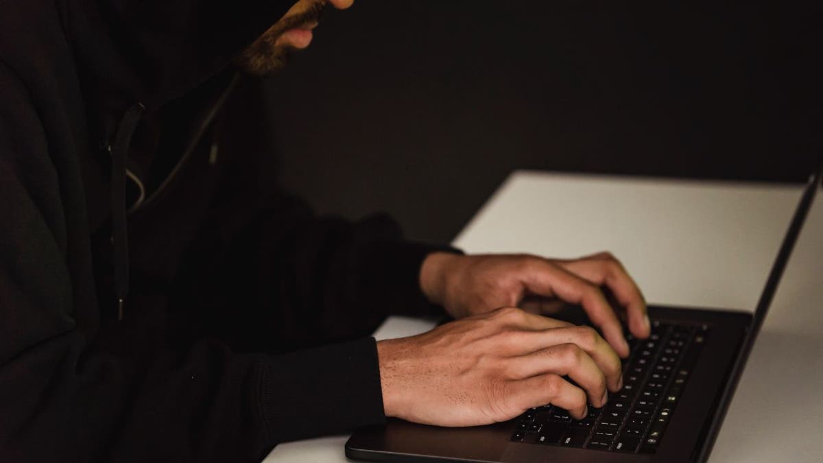 Man typing on her computer.