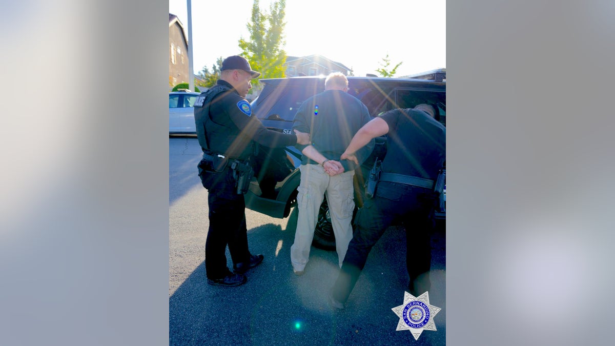 Steven Frasher being arrested outside his home