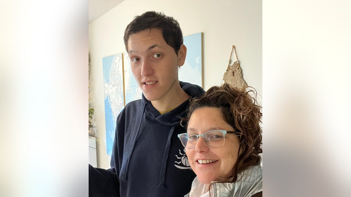 Laor Abramov (left) poses next to his mother, Michal Halev (right)