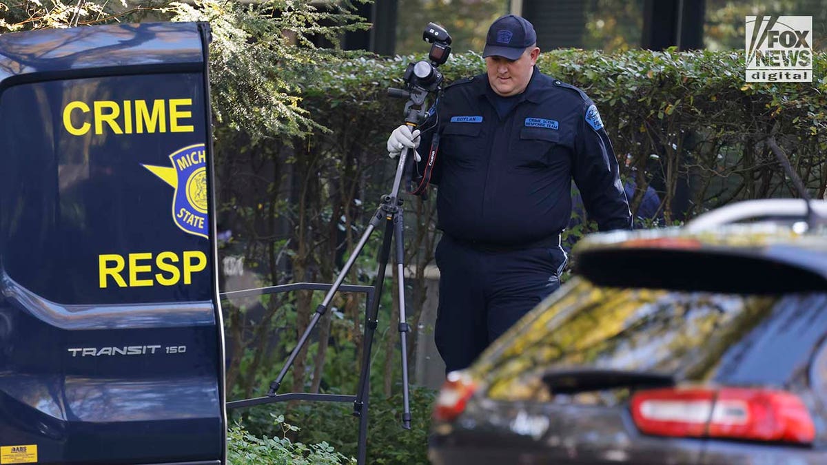 Michigan State Police Crime Scenes Unit compile evidence outside of Samantha Woll's home