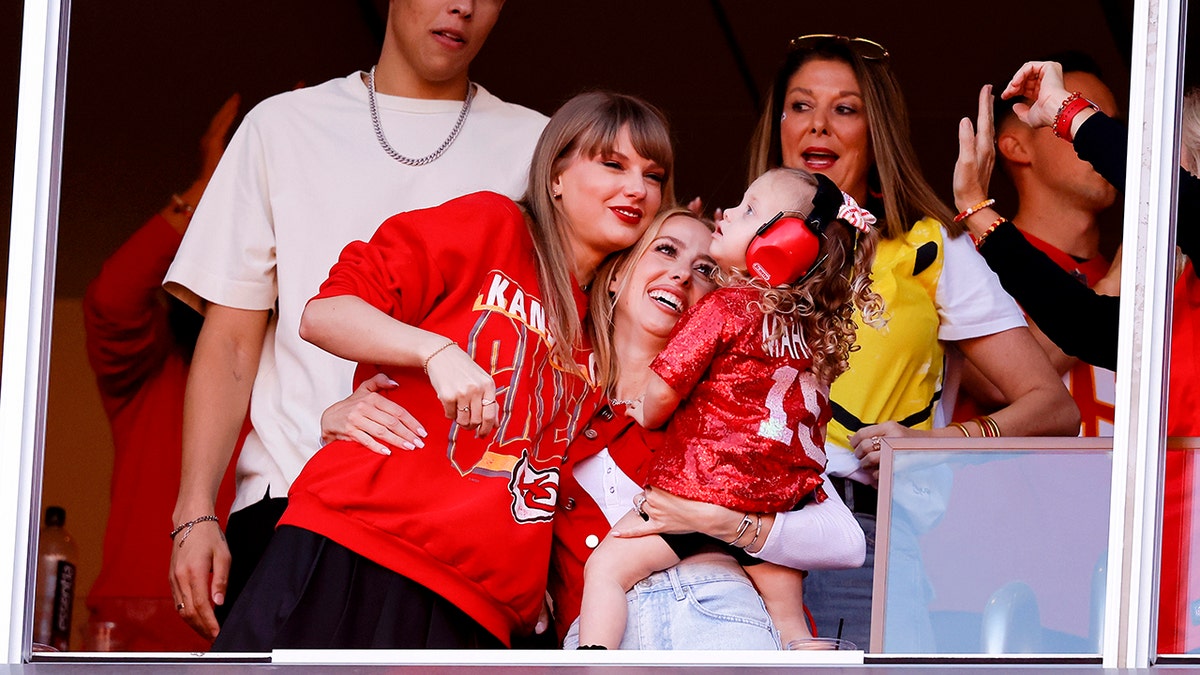 Taylor Swift and Brittany Mahomes embrace
