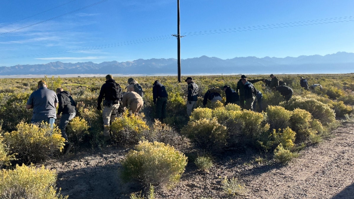 Investigators search in the desert area where Suzanne Morphew's remains were found