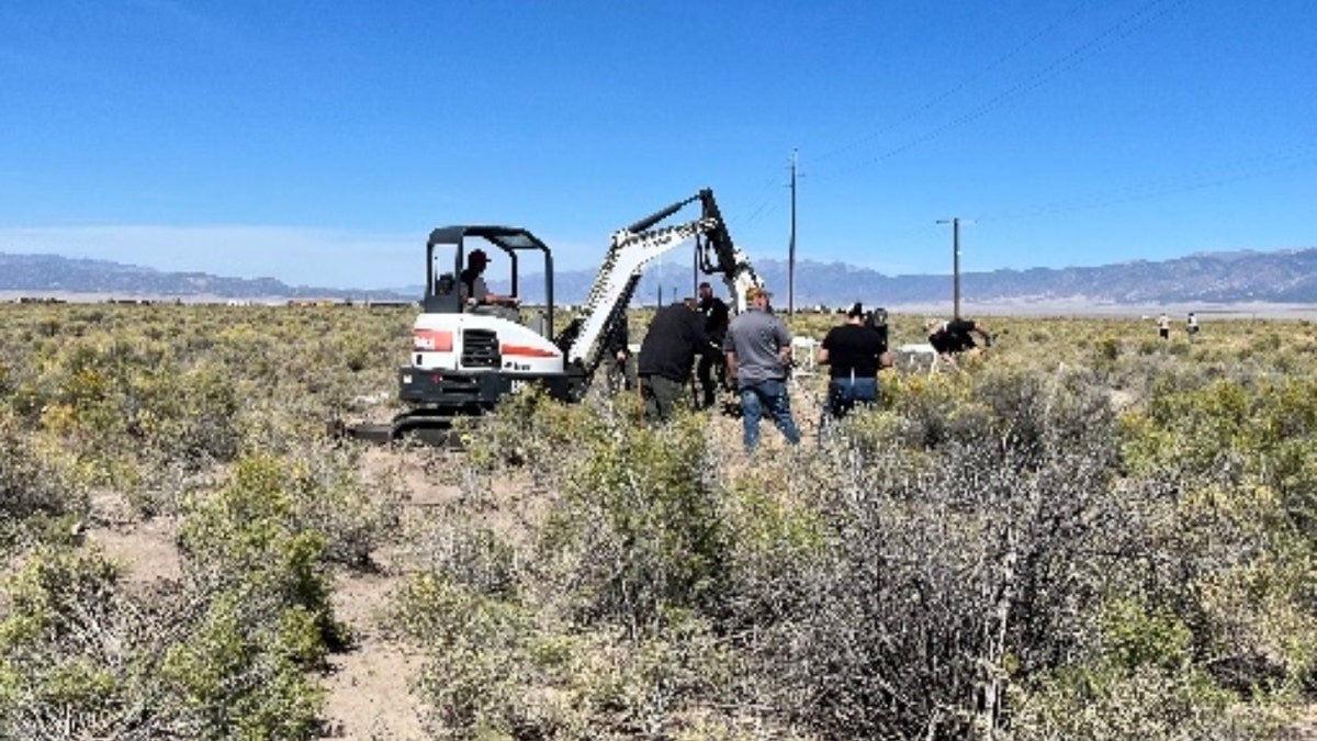 Authorities use an excavator in the area where Suzanne Morphew's remains were found