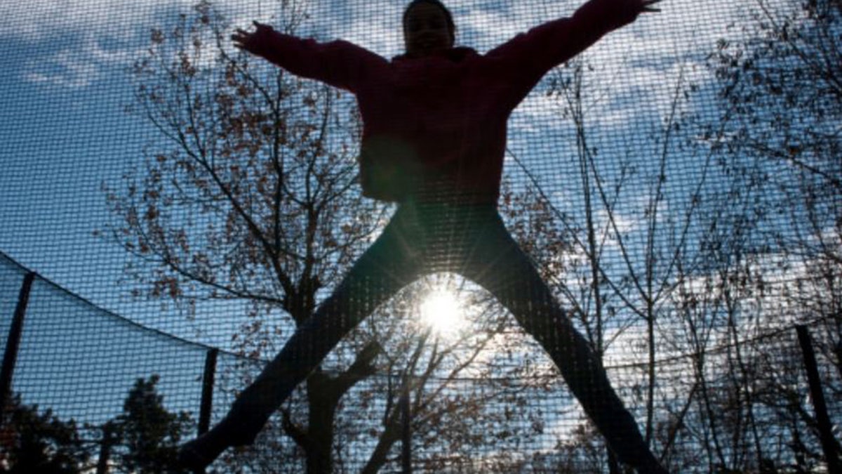 girl jumping on trampoline