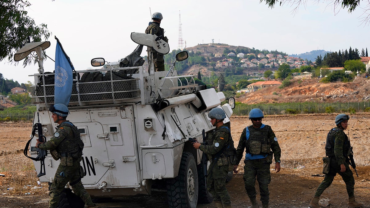 Soldiers around a tank