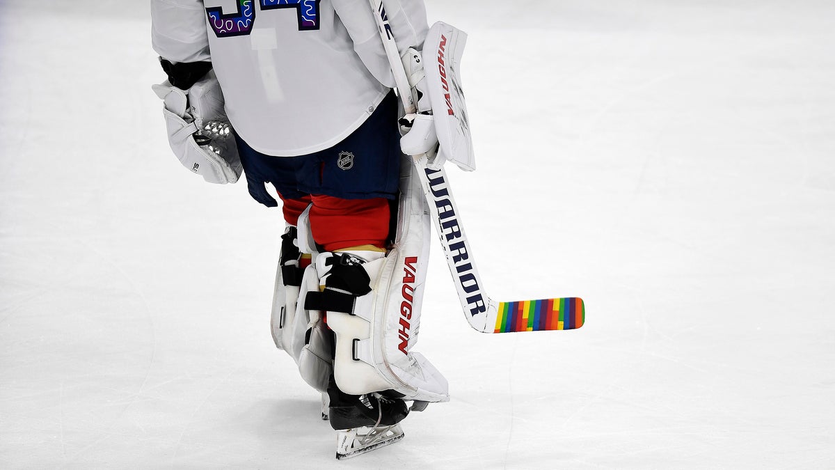 Hockey player with Pride Tape
