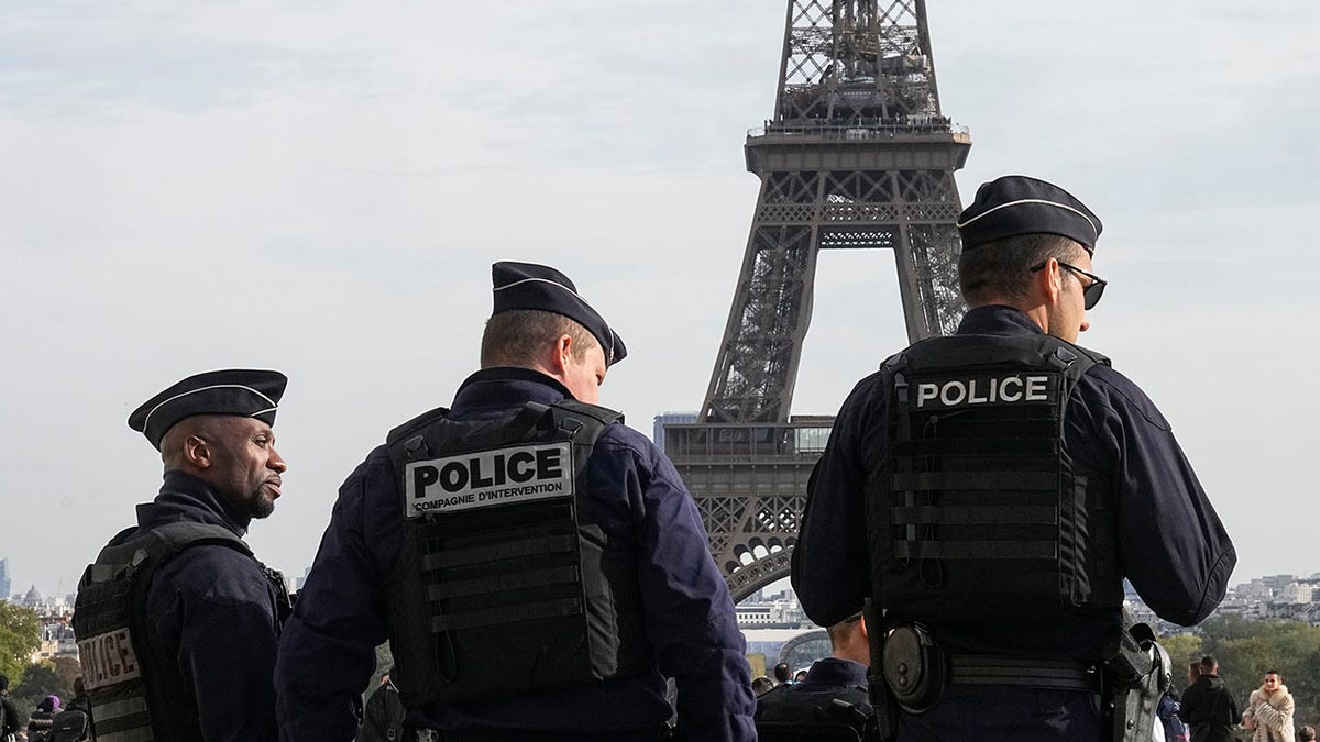Police officers outside Eiffel Tower