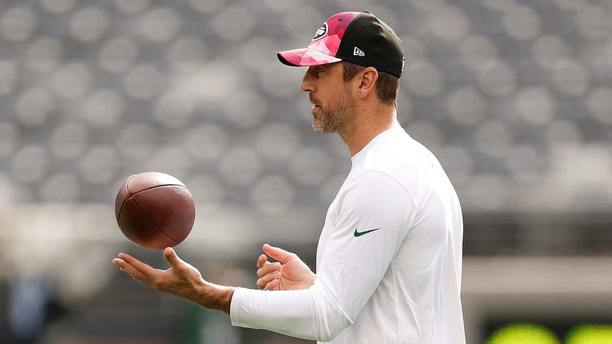 Aaron Rodgers spins football