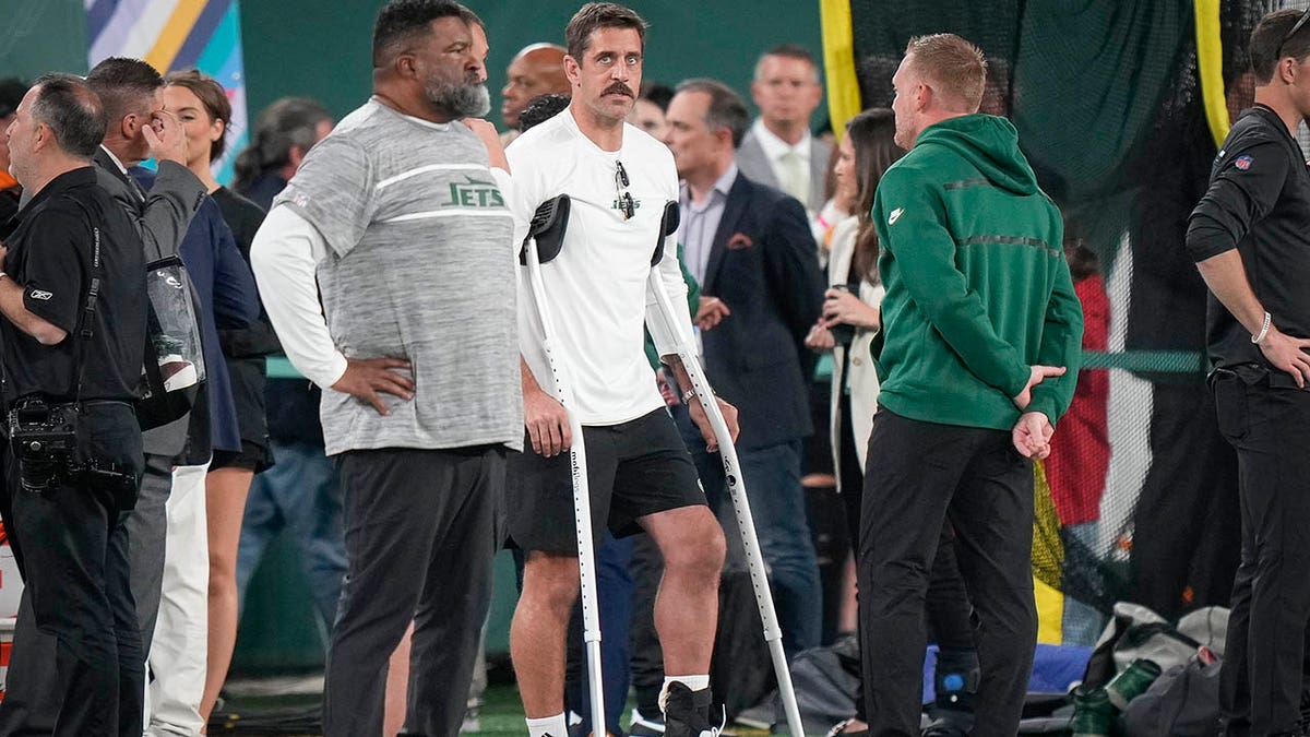 Aaron Rodgers on crutches