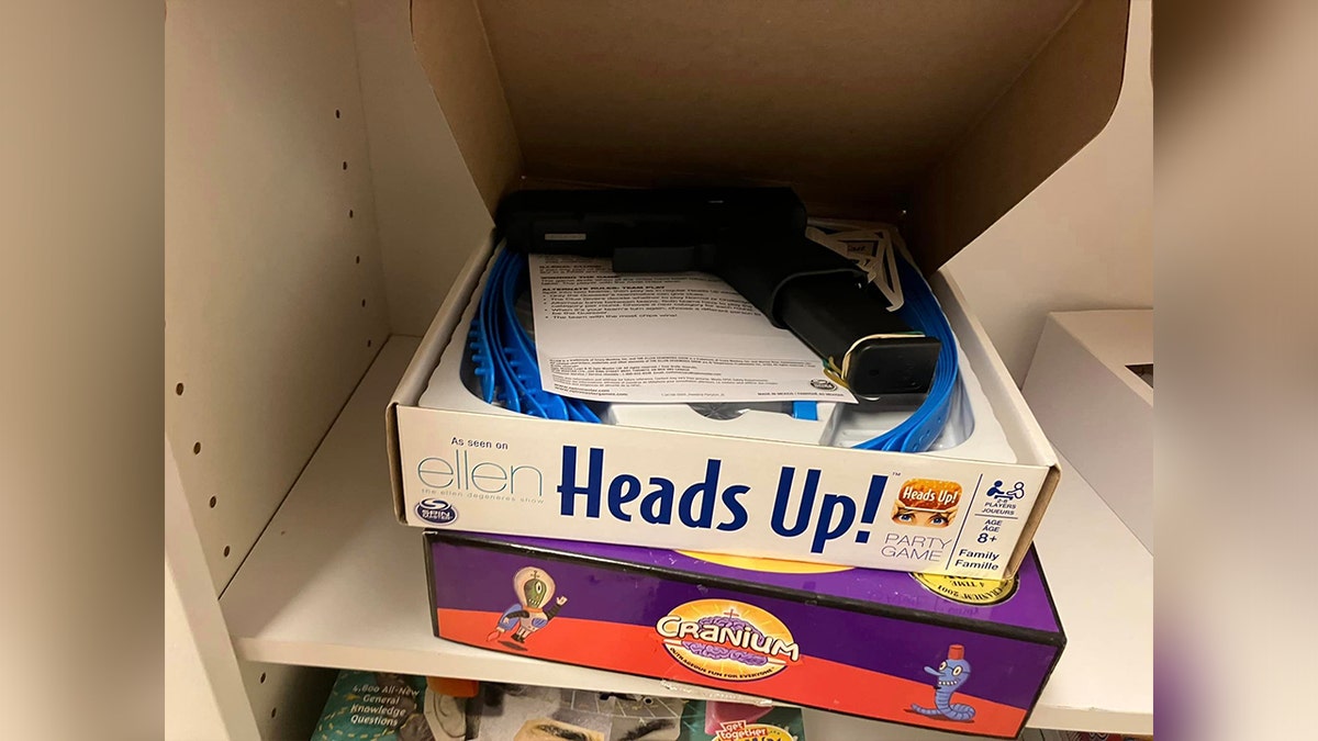 Gun hidden in Heads Up! box