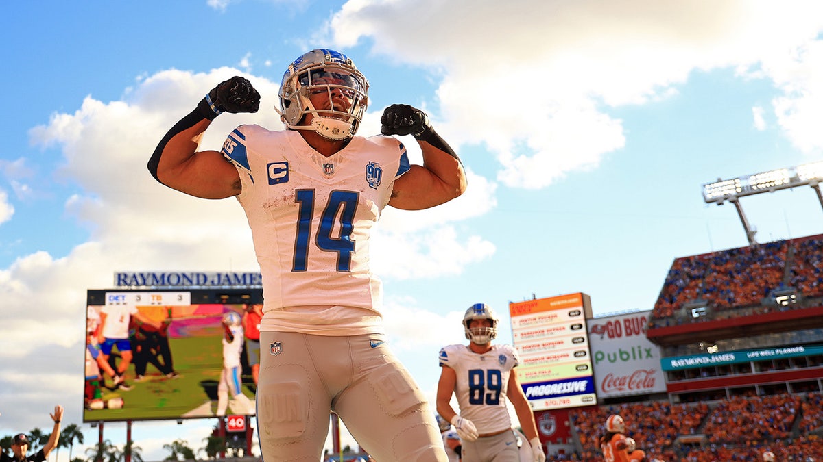 Amon-Ra St. Brown of the Detroit Lions celebrates