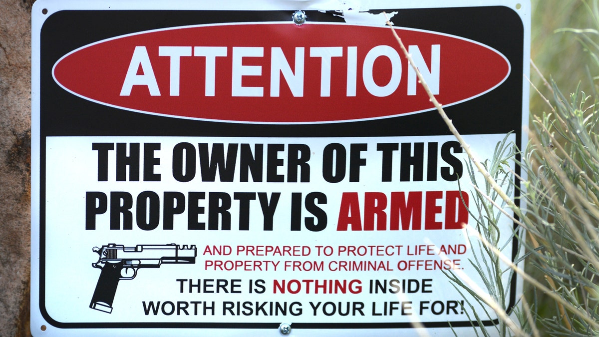 Gun warning sign