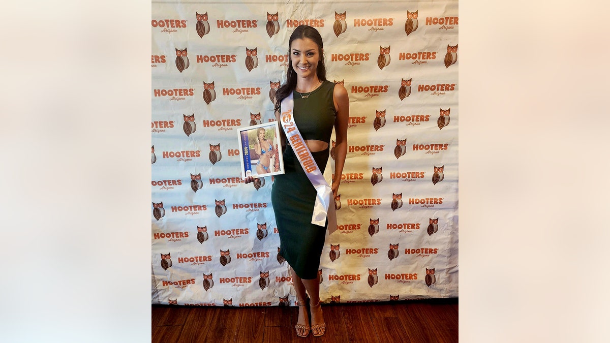 Averey Tressler as a pageant winner holding her calendar photo