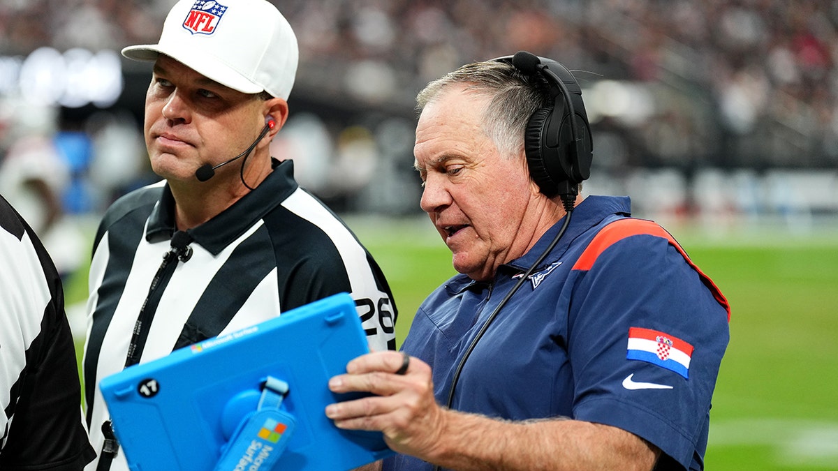 Bill Belichick with the tablet