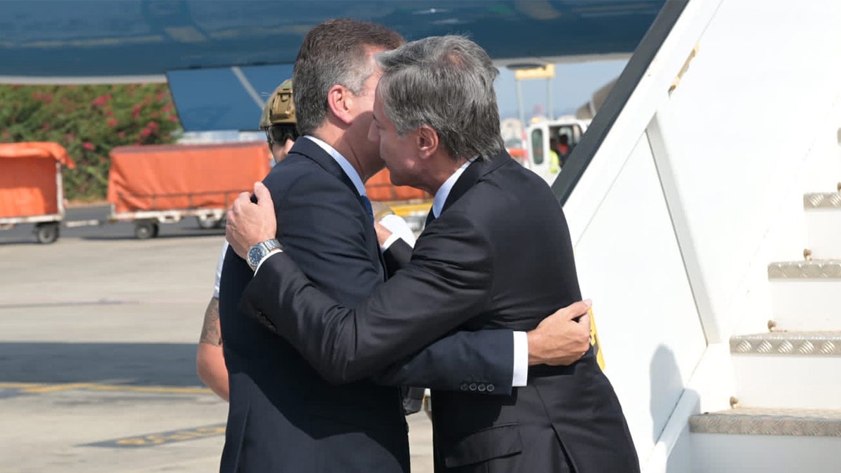 Blinken hugs Israeli Foreign Minister