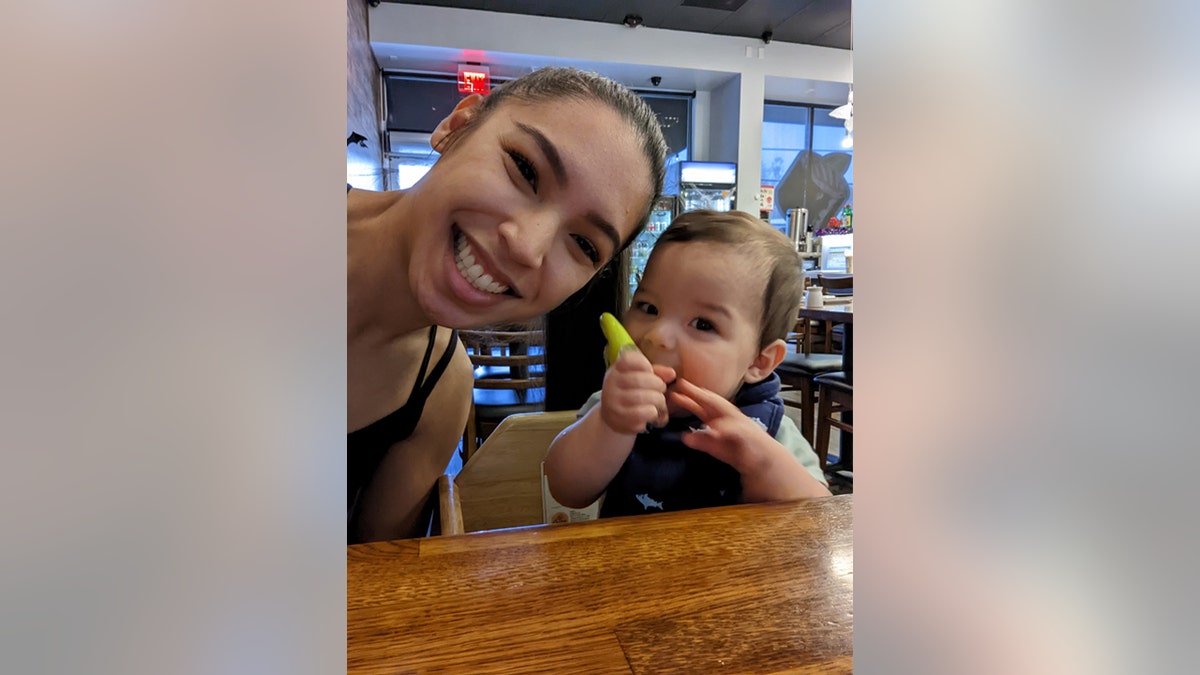 Brittney Mesa and her infant son, Greyson, side-by-side at table.