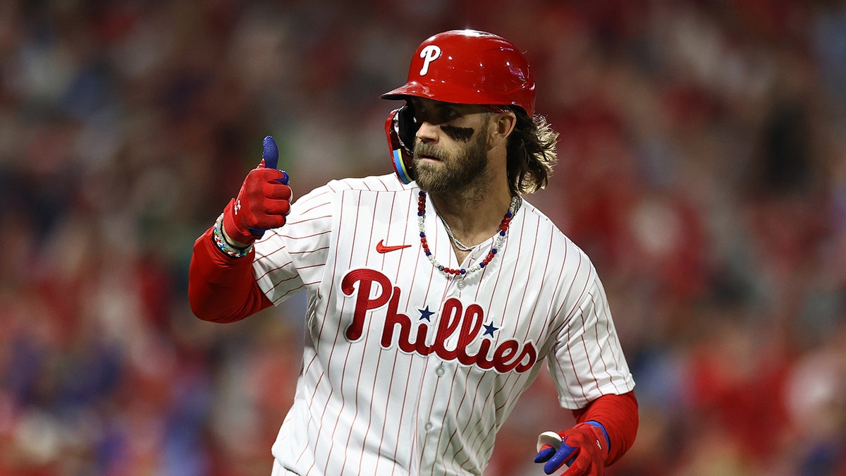 Bryce Harper reacts to dugout