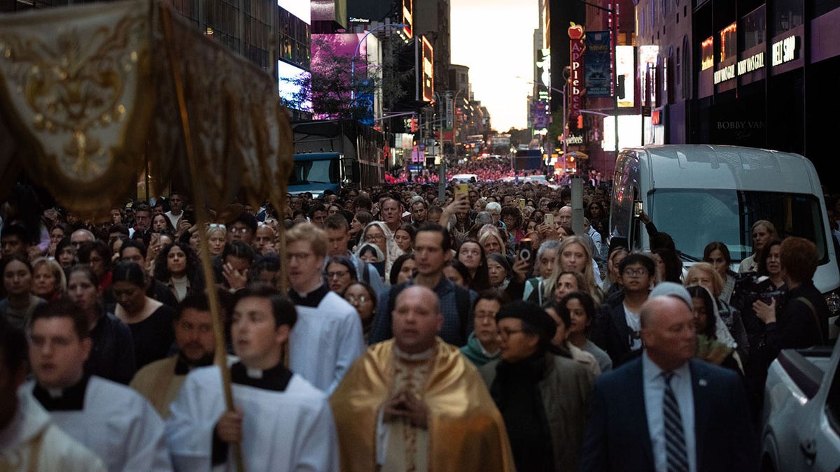 Catholics make a procession through Times Square