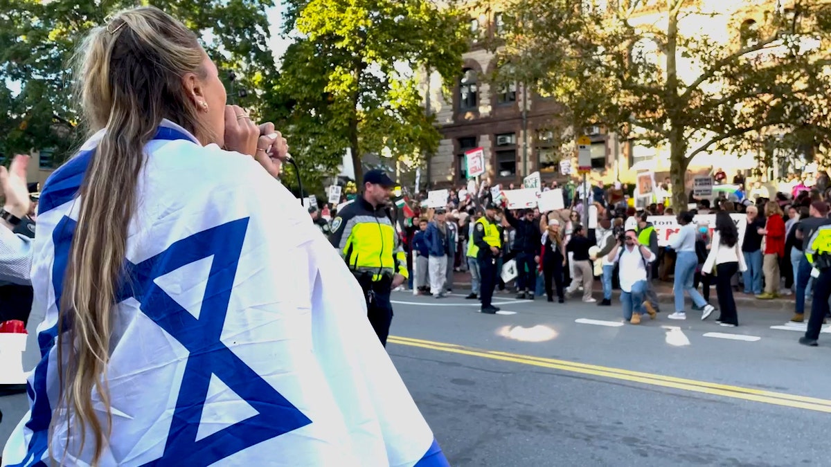 Israeli counter protestor shouts