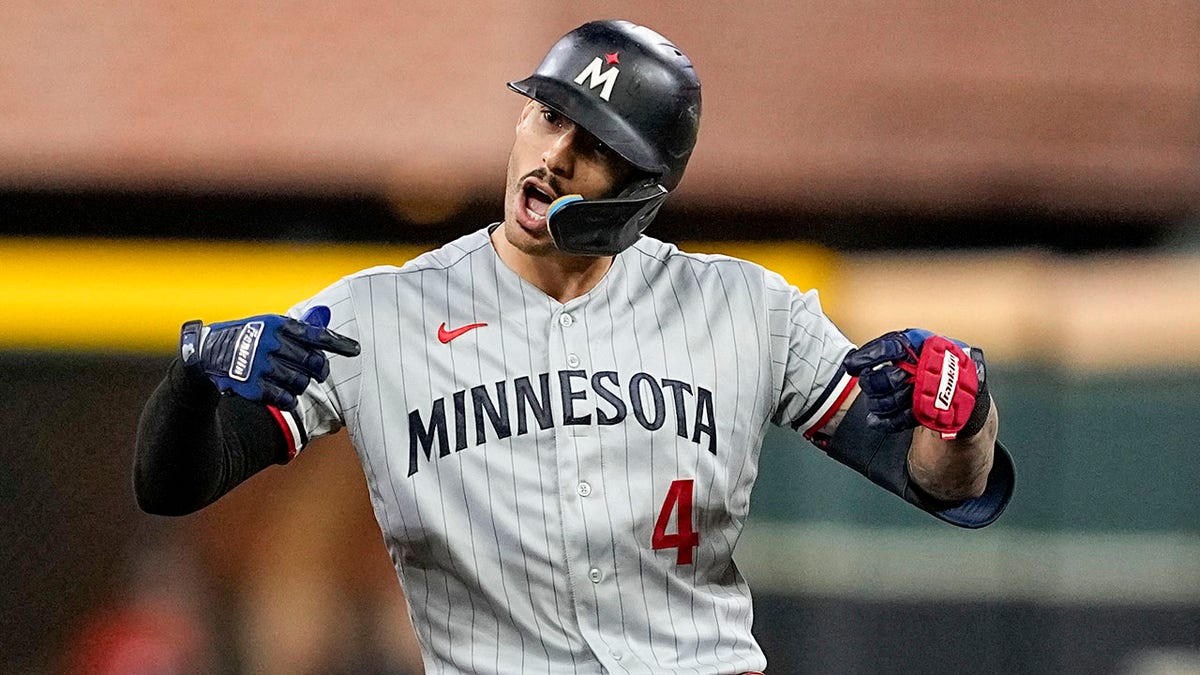 Carlos Correa celebrates