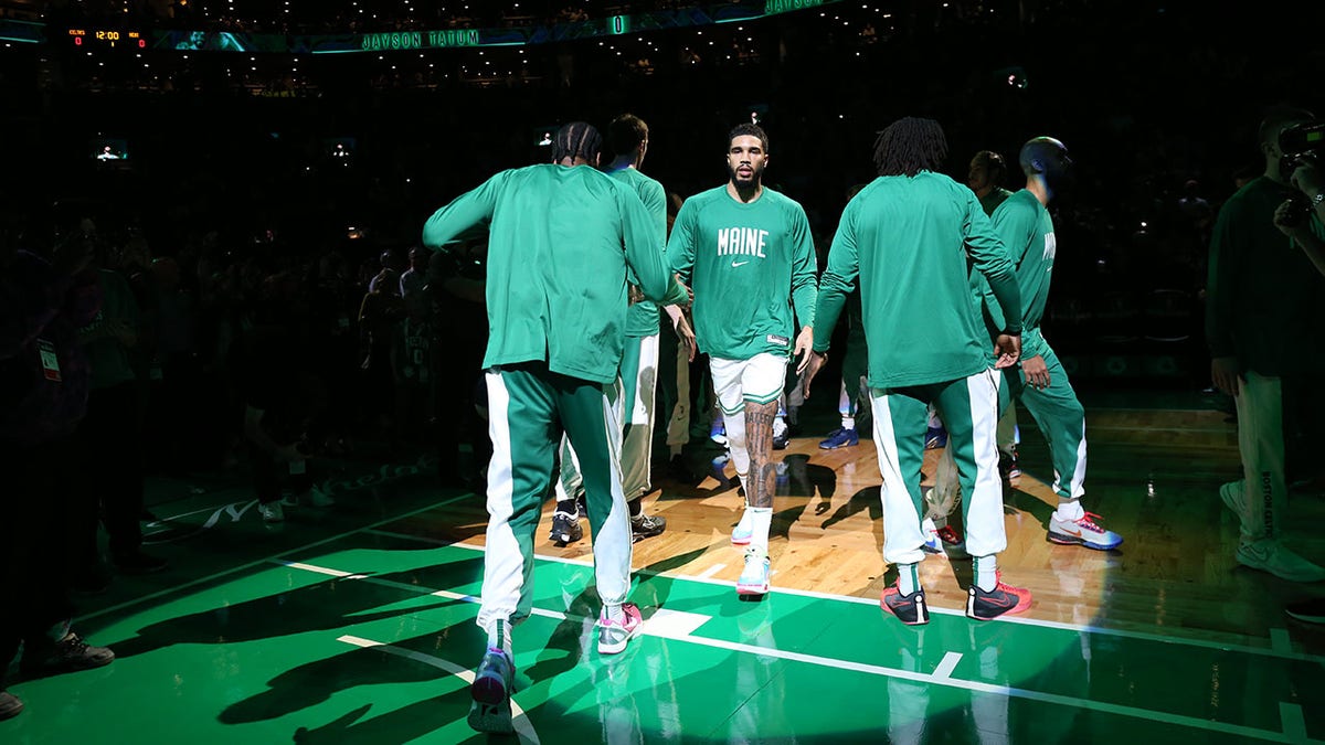 Celtics wear jersey patches to honor victims of Maine mass shooting, one day after social media post sparks backlash 2 Jayson Tatum is introduced before a game