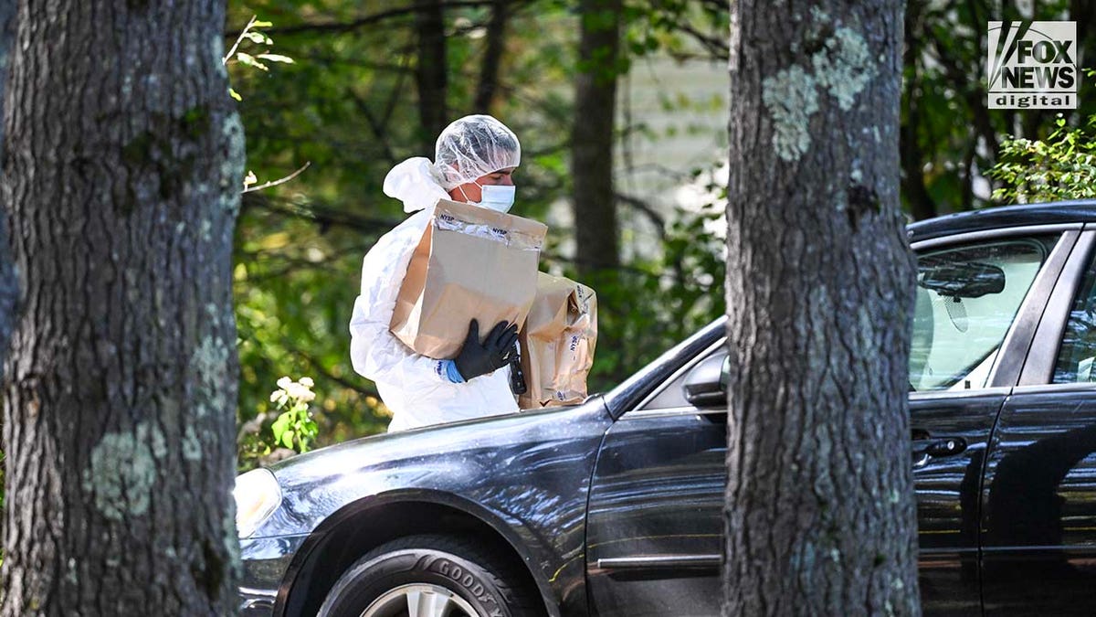 New York State Police collect evidence at the home of Craig Ross Jr.