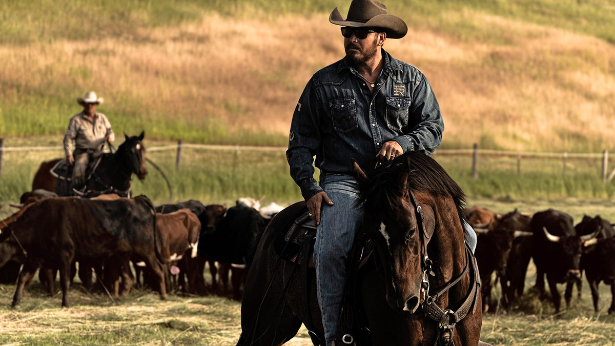 Cole Hauser rides a horse