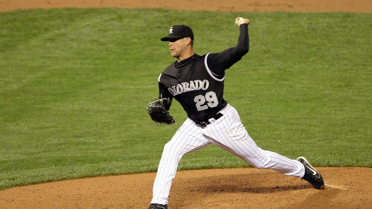 Dan Serafi pitches for the Rockies