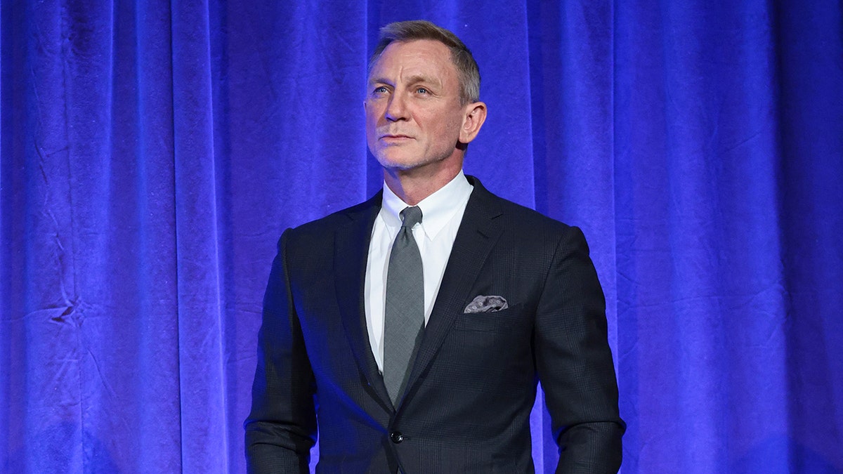 Daniel Craig posing on stage