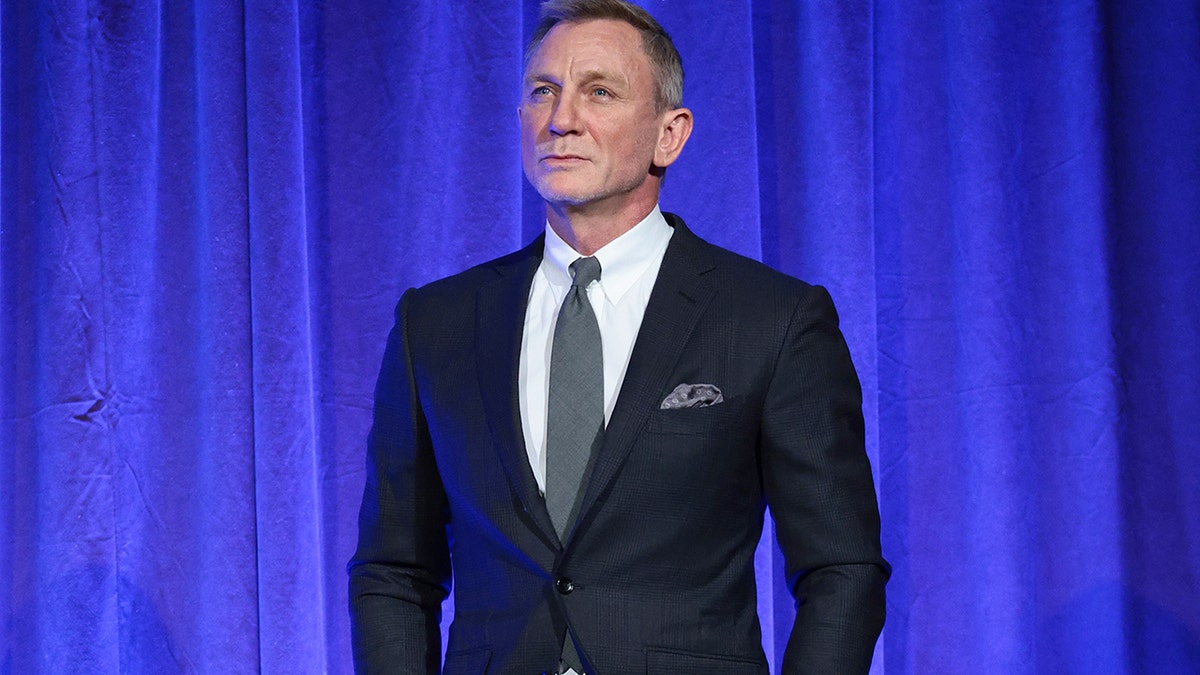 Daniel Craig posing on stage