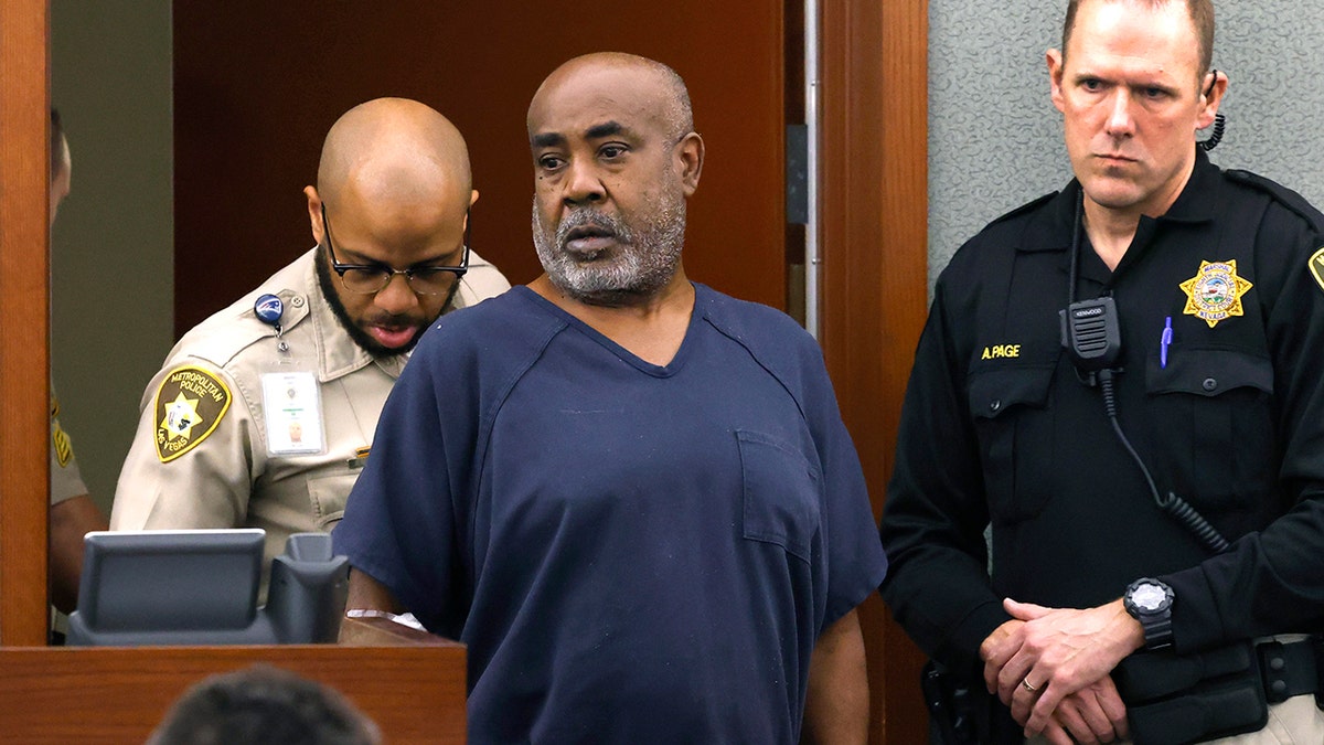 Duane Davis in handcuffs