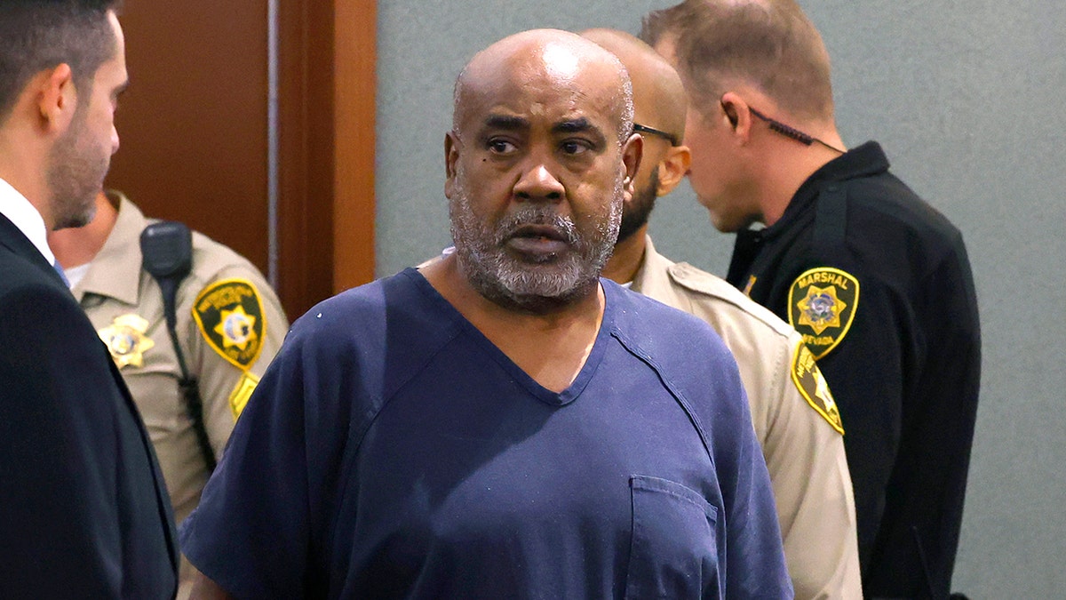Duane Davis being led into a courtroom