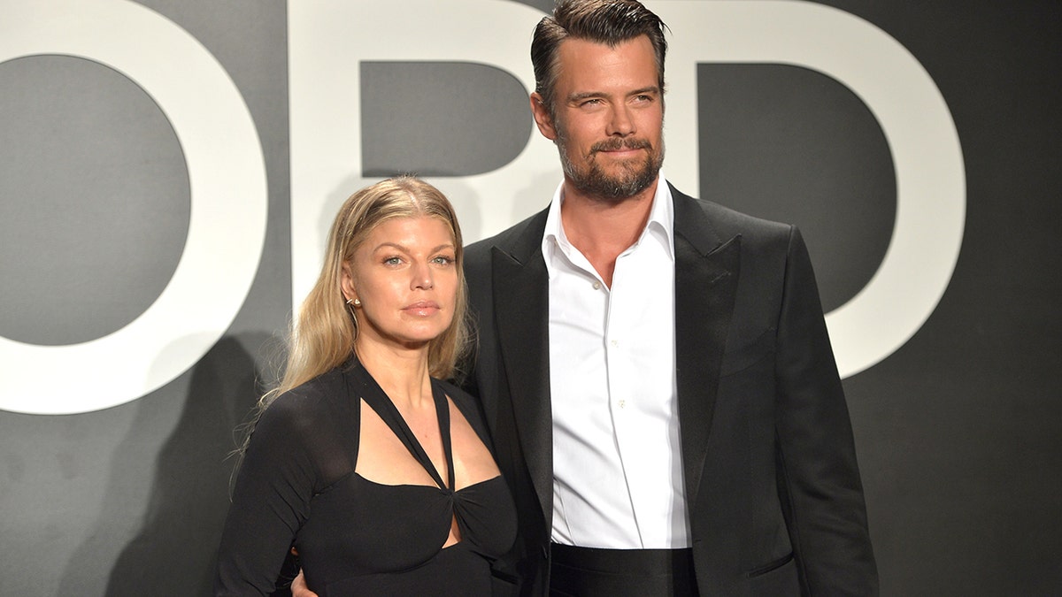 Fergie and Josh Duhamel posing together