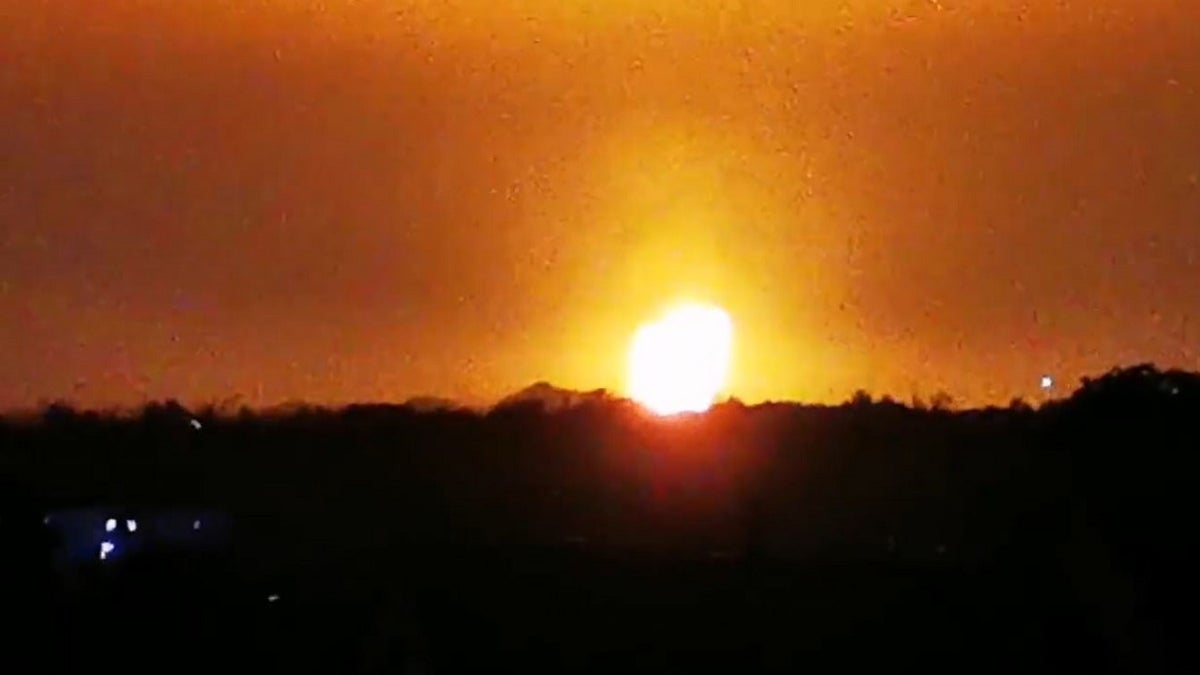 A large fireball in the night sky in England as flames can be seen from miles away